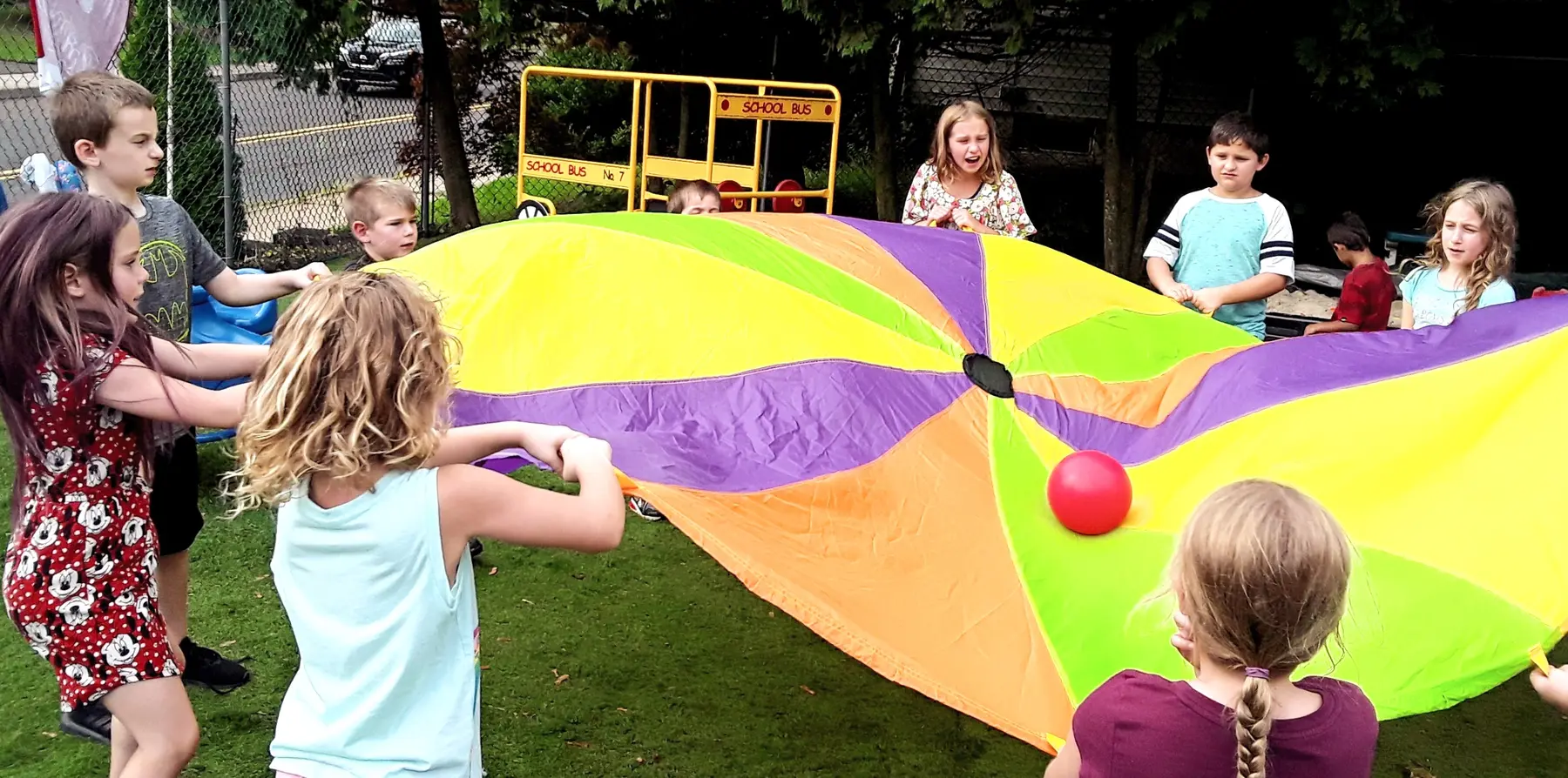 A group gathering in the outdoor play area