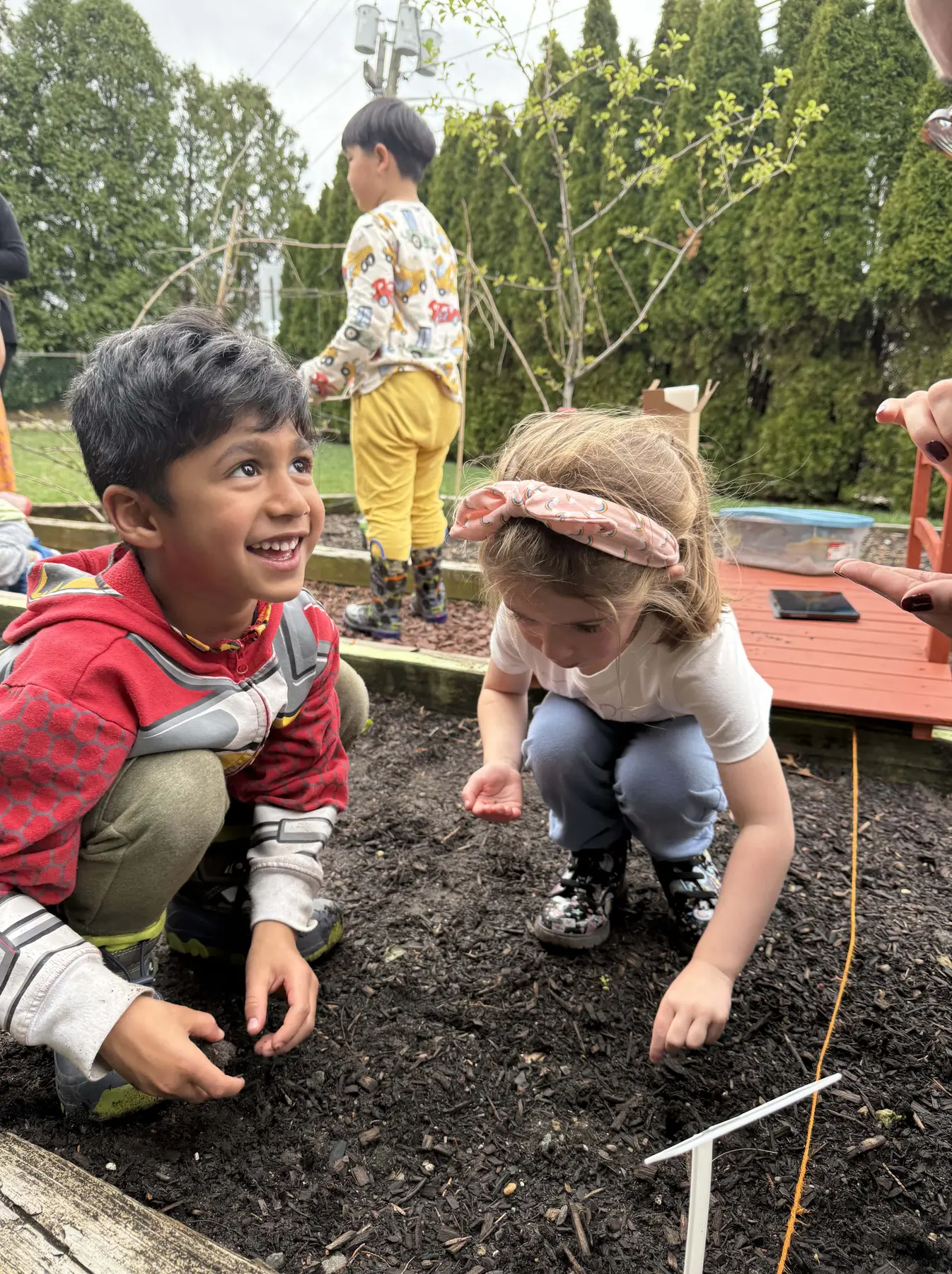 Preschool children playing outside