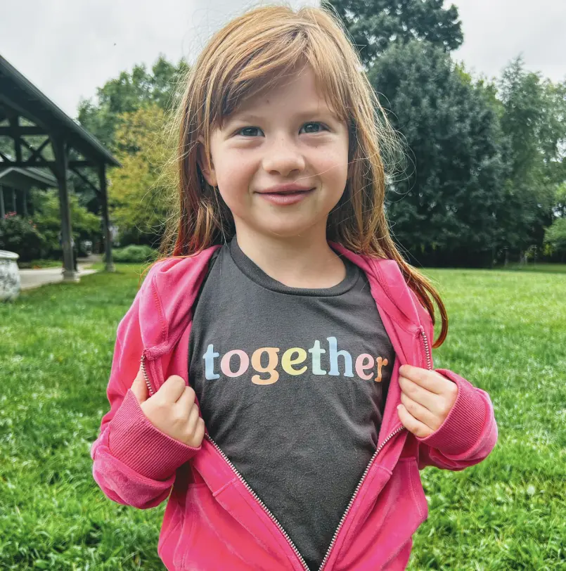 Student wearing a t-shirt that says "together".