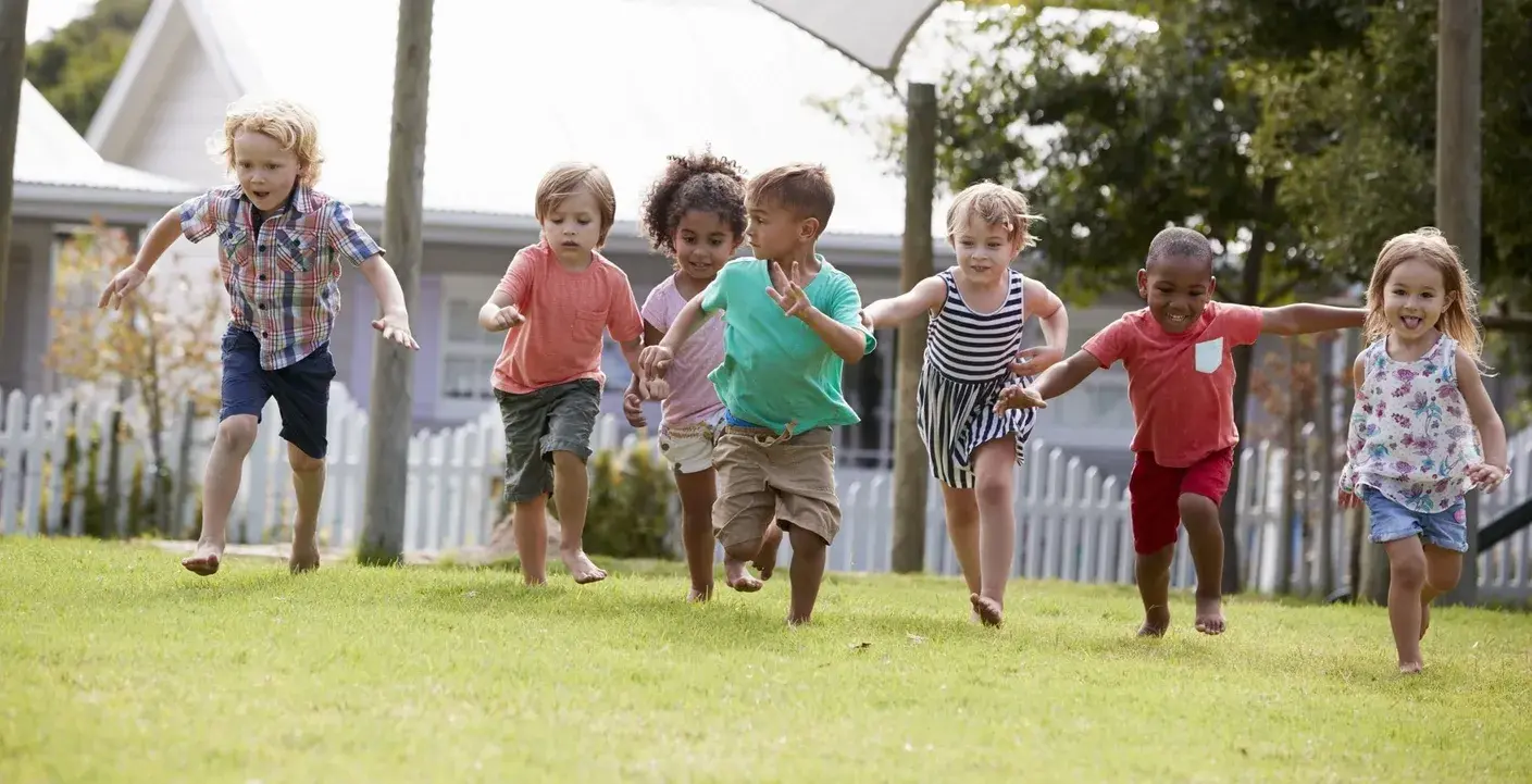 A group gathering in the outdoor play area