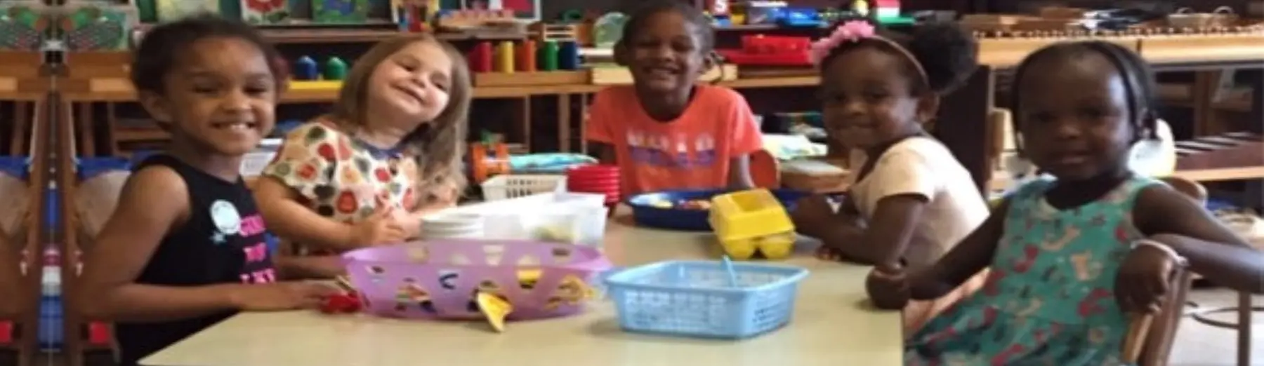 female teacher with kids smiling