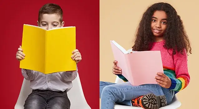 Two children sit on white chairs holding open books with solid-colored covers, one against a red background and one against a tan background.